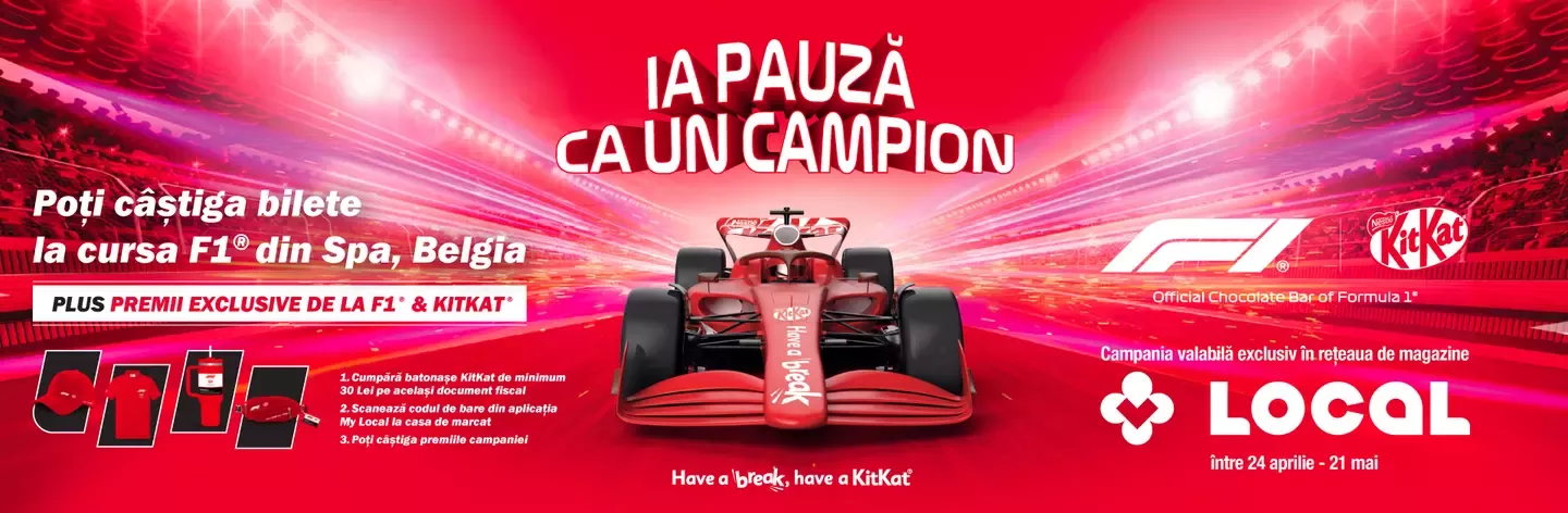 Red Formula 1 car racing on a track with a KitKat and F1 promotion for winning tickets to the Spa, Belgium race.