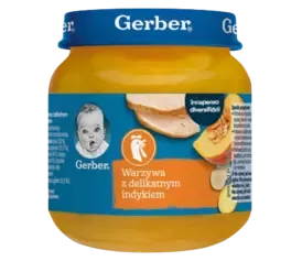Jar of Gerber baby food labeled "Warzywa z delikatnym indykiem" (vegetables with tender turkey) with an orange and blue label